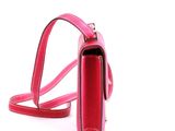 pink purse with strap on white background on white surface