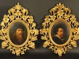 deux portraits encadrés représentant un homme barbu et une femme barbue
