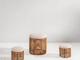 un ensemble composé de trois tabourets et d'un tabouret en osier
