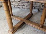 a wooden table with two legs and a table top