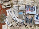 a pile of old newspapers on the floor of a room