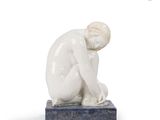 statue of a man sitting on a marble base with his hands on his knees
