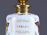 an image of a bottle of perfume sitting on top of a table