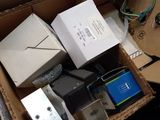 a box of electronics that is sitting on the floor