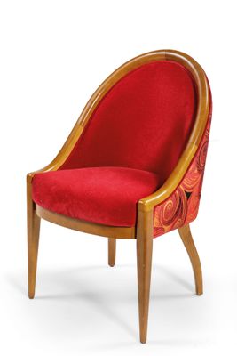 an image of a red chair with wooden legs and a red cushion