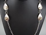a close up of a necklace on a mannequin mannequin