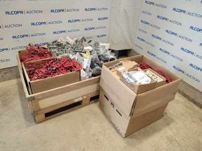 two boxes of assorted items in front of a wall