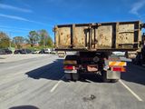 a dump truck that is parked in a parking lot