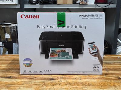a box with a printer and a cell phone in it