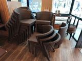 many chairs and stools in the corner of a restaurant