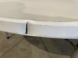a white table with a hole in the middle of it