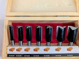 an image of a wooden box with a set of router bits in it