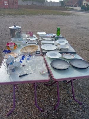 a table that has a lot of plates and bowls on it