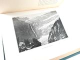 an open book with a black and white photo on it