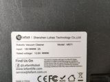 a close up of the back of a laptop with a label on it