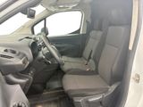 the interior of a car with the door open and the driver ' s seat down