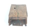 an old wooden box with a green string on it