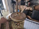 a table that has a lamp on it in a room