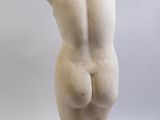 sculpture of a female torso on a marble base