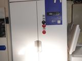two refrigerators that are in a room with tile flooring