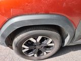 a close up of a car ' s tire on the road