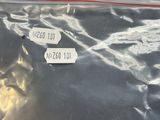 a plastic bag with a tag on it sitting on a table