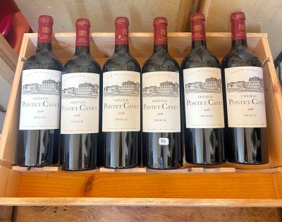 six bottles of red wine in a wooden box