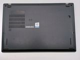 a black laptop with a blue sticker on the back of it