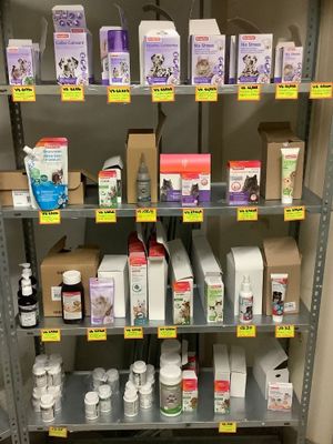 a lot of medicine products on the shelves in the store
