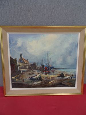 painting of boats on the beach in front of a red table