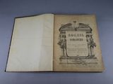 an open book with a picture of a statue on top of it