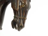 statue of a horse with a bridle on it ' s head