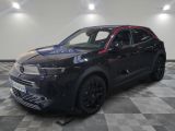 a black suv parked on a checkered floor in a garage