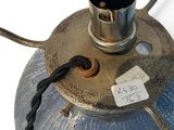 a metal lamp that has a tag on it