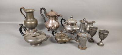 a lot of silver items that are sitting on a table