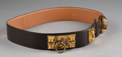 a black belt with a gold buckle on it
