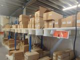 many boxes on the shelves in the warehouse