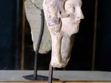 a statue of a woman that is sitting on a table
