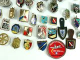 a lot of badges that are on a table