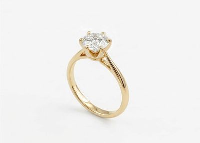 a gold engagement ring with a single stone diamond