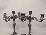 a pair of antique silver plated candelabs