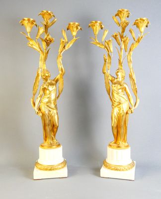 pair of gilded bronze and marble vases with flowers on marble bases