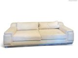 an image of a white couch with pillows on it