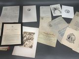 a lot of papers on a table with a picture on it