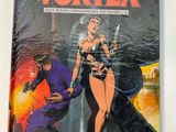 the cover of vortexex magazine, featuring a woman in a bikini and a man in a purple suit