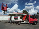 a red truck with a crane on the back of it