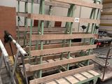 a dolly truck with a lot of pallets on it in a warehouse