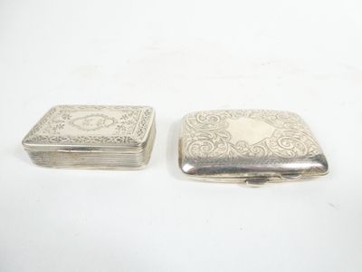 two small silver boxes sitting on top of each other on a white surface