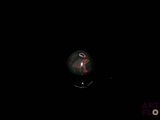 an image of a black background with a light bulb in the dark