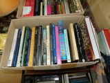 a box full of books sitting on a table